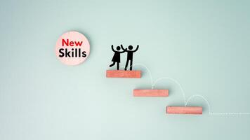 Skills icon and human drawing on wooden block. Upskilling and personal development concept. Employee thinking, digital upskill, Skill training, education, learning, ability. Upskilling, reskilling. photo