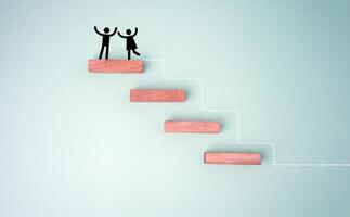 Wooden block stacking as step stair with red paper plane on blue background, Ladder of success in business growth concept. photo
