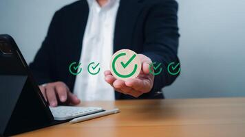 ISO certification and standardization concept, Hand shows sign of top service Quality assurance, Guarantee, Standards, satisfaction, Service experience, Show the standards of products and services. photo