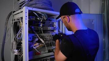 It engineer setting up server while working with data network video