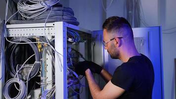 It specialist setting up server while working with data network video