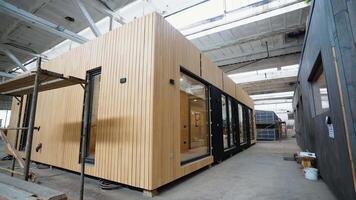 Prefabricated modular mobile wooden house at construction site video