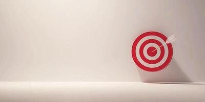 A red and white target with an arrow hitting the center, representing accuracy, success, focus, and goal achievement. photo