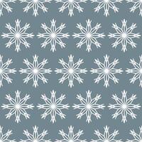 Seamless pattern of white snowflakes on a gray background vector