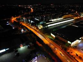 Aerial View of Illuminated Central Cambridge City of Cambridgeshire of England UK During Night. High Angle Footage Was Captured with Drone's Camera at Just After Sunset on March 22nd, 2024 photo