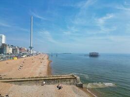 Aerial View of British Tourist Attraction of Beach and Ocean at Brighton and Hove Coastal City of England United Kingdom. High angle Footage of British Tourist Attraction Was Captured on May 9th, 2024 photo