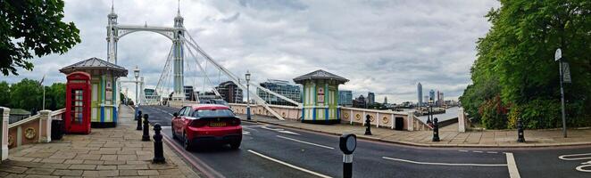Wide Angle Panoramic Central Chelsea London city on river Thames Albert Bridge Road England United Kingdom. Low Angle High Resolution Image Was Captured on June 3rd, 2024 photo