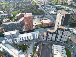 Iconic Buildings at Central Greater Manchester City Centre and Tall Buildings During Golden Hour of Sunset over England UK. Aerial Footage Was Captured with Drone's Camera on May 5th, 2024. photo
