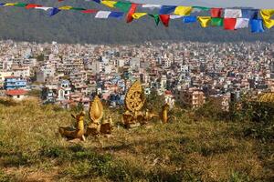 Buddhist symbols on a hill against the background of the city of Kathmandu, Nagarjun Nepal. photo