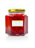 Hexagonal glass jar of homemade red currant berry or cranberry jam with a gold lid and blank label. Isaolated on white background. Copy space. photo