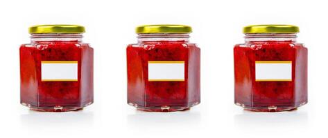 Trio of red currant berries jam jars with green, red, and blue hues, each with metallic lids and blank label for customizable branding, isolated on white background. Three vibrant marmalade glass jars photo