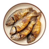 Deliciously fried small fish served on a plate against a clean transparent background, small fried fish in plate on transparent background png