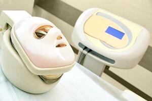 Advanced facial rejuvenation device in modern aesthetic clinic setting for skincare treatments. photo
