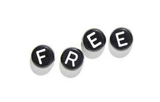 Black keyboard keys spelling free with shadows on white background symbolizing freedom and creativity photo