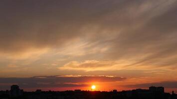 The sun sets over the city skyline photo