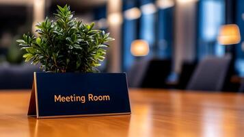 Meeting Room sign on office glass wall with empty collaboration workspace, large table, and armchairs in background. photo