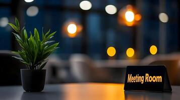 Meeting Room sign on office glass wall with empty collaboration workspace, large table, and armchairs in background. photo