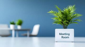 Meeting Room sign on office glass wall with empty collaboration workspace, large table, and armchairs in background. photo