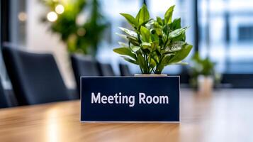 Meeting Room sign on office glass wall with empty collaboration workspace, large table, and armchairs in background. photo