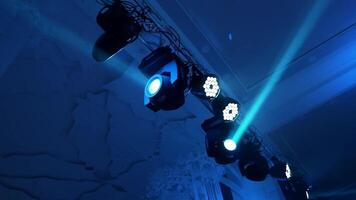 Colorful lights from projectors shining brightly from the ceiling inside the club. Flashing rays with different colors from spotlights in the nice hall. video