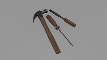 A hammer and a screwdriver on a gray background photo