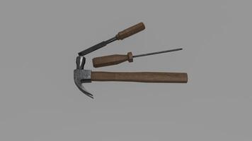 A hammer and a screwdriver on a gray background photo