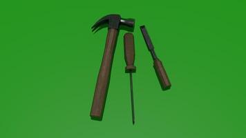 A hammer and screwdriver on a green background photo