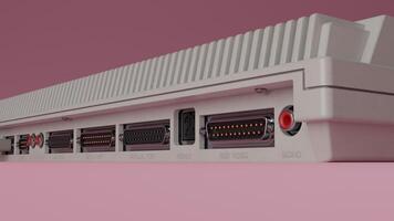 A close up of a white computer with a red and black cable photo
