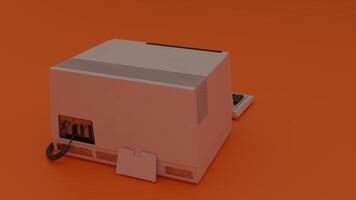 A small computer on an orange surface photo