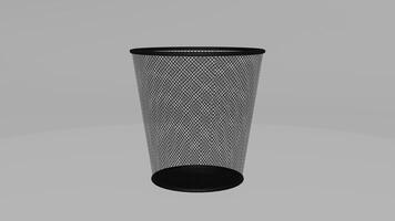 A black trash can with mesh netting on top photo