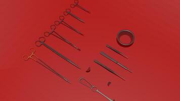 A set of surgical instruments on a red surface photo