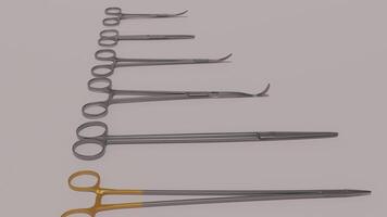 A set of surgical instruments are lined up on a table photo