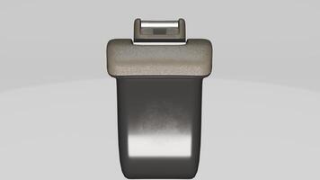 A black and silver object with a small button photo