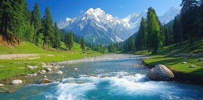 A River Flows Through A Mountainous Valley With Snow-Capped Peaks photo