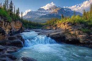 Waterfall cascading through a rocky canyon with snow-capped mountains in the background photo