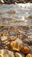 Sunlit Pebbles and Sparkling Water on a Beach photo
