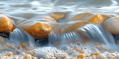 Smooth Water Flowing Over Smooth Pebbles photo