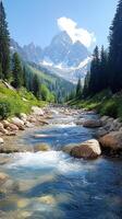 Mountain Stream Flowing Through a Valley With a Snow-Capped Peak photo