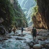 Hikers Trekking Through a Mountain Gorge with a Stream photo