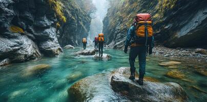 Hikers Trekking Through a Narrow Gorge with a Clear Stream photo