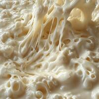 Close-up of Creamy, Whipped, and Dripping Substance photo