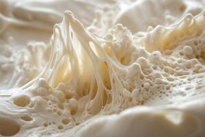 Close-up of Creamy, Whipped, Foamy Texture with Air Bubbles photo