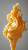 Caramel Syrup Splash with Abstract Swirls and Shapes photo