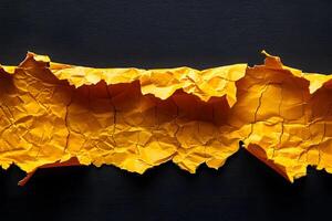 Vibrant Yellow Torn Paper Texture on Black Background for Design Projects photo