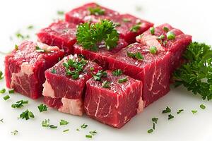 Fresh Raw Beef Cubes Garnished with Parsley and Chives for Culinary Preparation photo