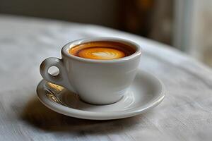 Elegant Ceramic Cup of Artisanal Espresso on Textured White Tablecloth photo