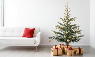A white couch sits in front of a Christmas tree with gold ornaments photo