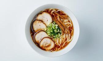 A bowl of ramen with meat and vegetables photo