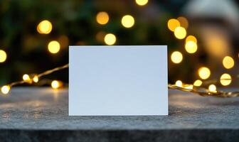 A white card with a blank space sits on a table photo