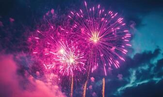 A fireworks display in the sky with three fireworks in the middle photo